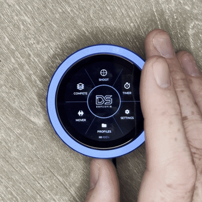 Hand rotating the DopeSpin ring through the radial hub menu on the circular display